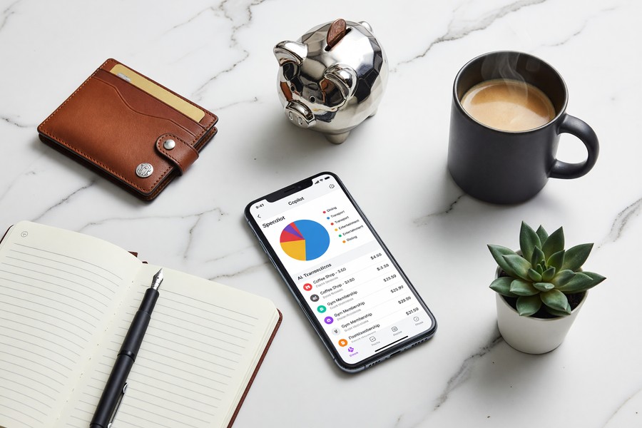 Side-by-side comparison of YNAB, Monarch Money, and Copilot app dashboard interfaces on smartphones