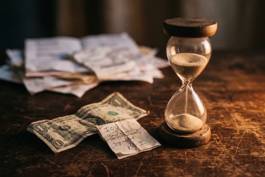 Freelancer reviewing monthly expense breakdown to calculate emergency fund target