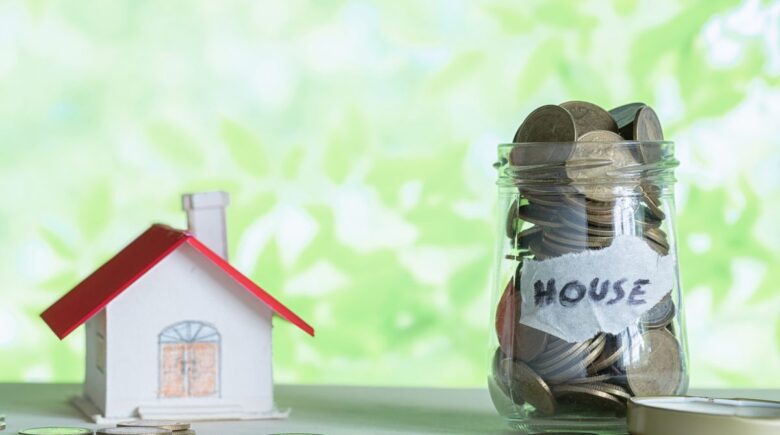 Person budgeting and planning finances for down payment while renting apartment