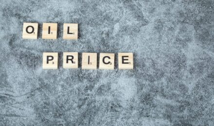 Calculator and home equity line of credit statement showing interest savings from prime rate cut