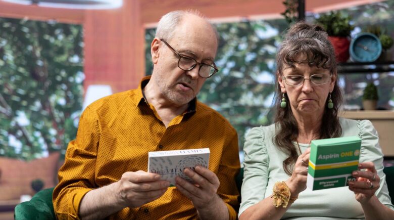 Couple reviewing financial documents and healthcare bills during early retirement planning