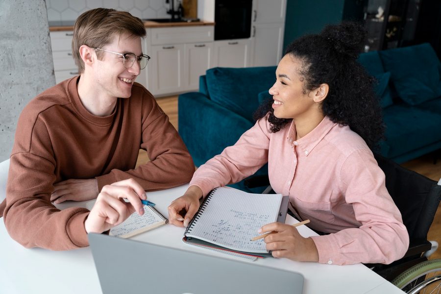 Young professional reviewing a salary offer or side‑hustle income on a laptop