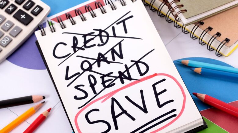Person reviewing credit card statements and payment strategy during rising interest rates