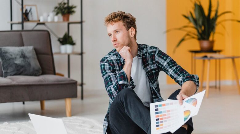 Real estate investor analyzing portfolio stress test scenarios with mortgage rate and insurance cost charts